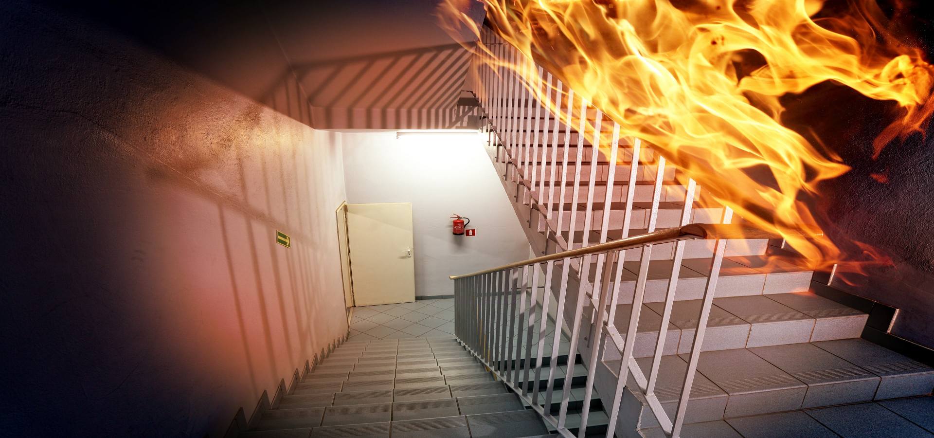 building stairs caught on fire showing a door and extinguisher